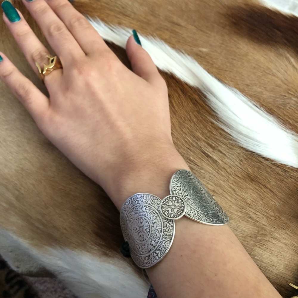 Silver coin bracelet.